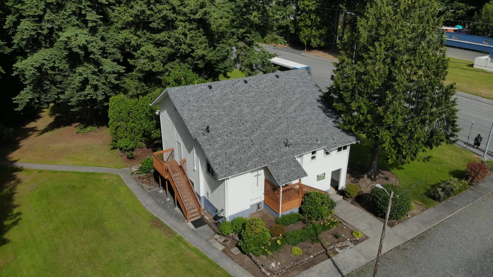 Aerial view of the New Beginnings Church building among the trees in Lynnwood